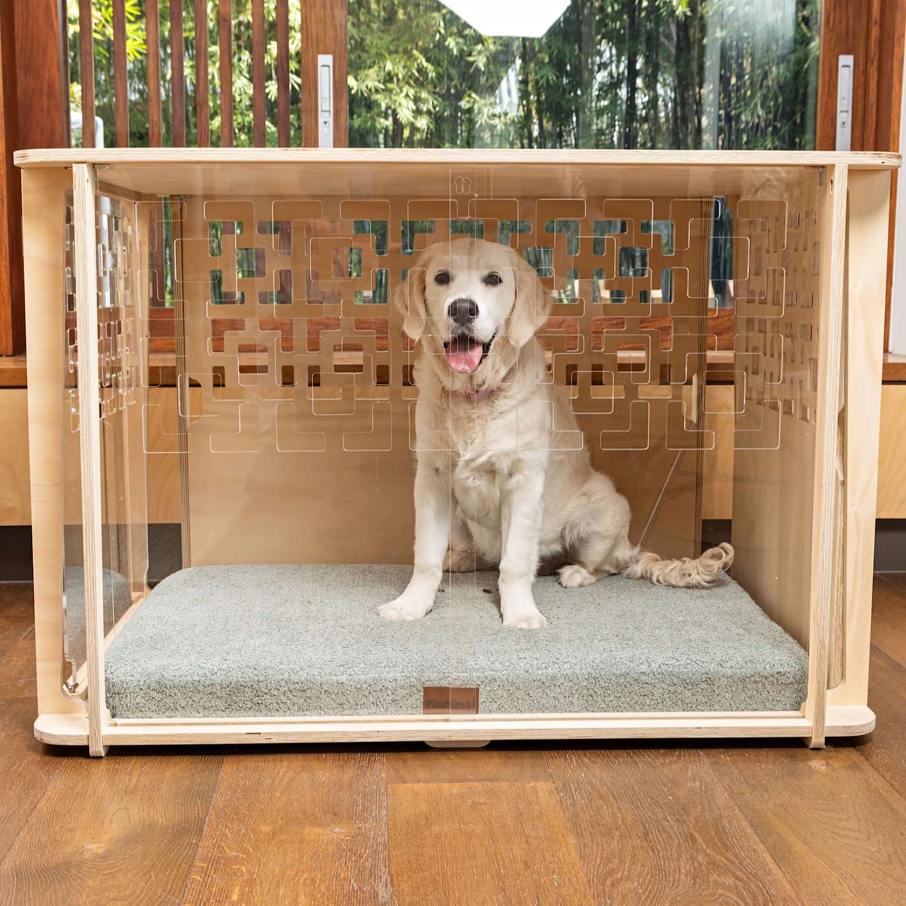 Golden Retriever sitting on orthopaedic mat inside the Harley Wooden Dog Crate